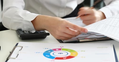 Woman Hands Filling Documents in Modern Office