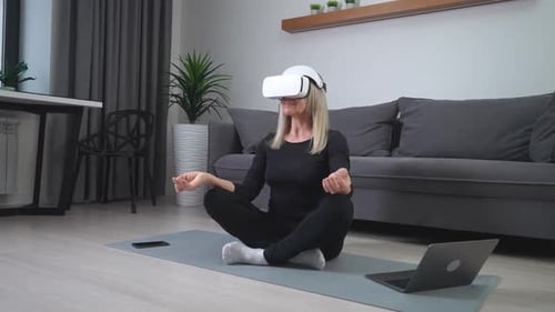 Woman Meditating in VR Headset at Home