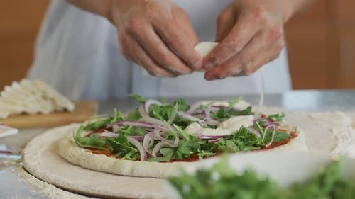 Adding Fresh Mozzarella to a Delicious Pizza