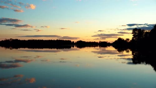 Panorama of the Lake at Sunset. The Lake Reflects the Sky