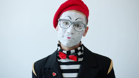 Slow Motion Portrait of Mime Artist Smiling and Moving Head Looking at ...