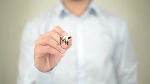 Man Writing "Make a Change" on Clear Surface