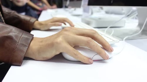 Hands on Computer Mouse at Workplace