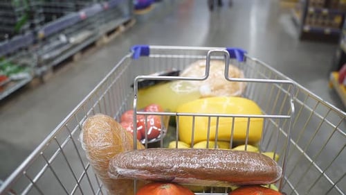 Shopping Cart Moving Between Various Section in Supermarket