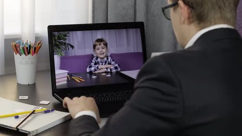 Online Lesson with Child on Laptop at Home