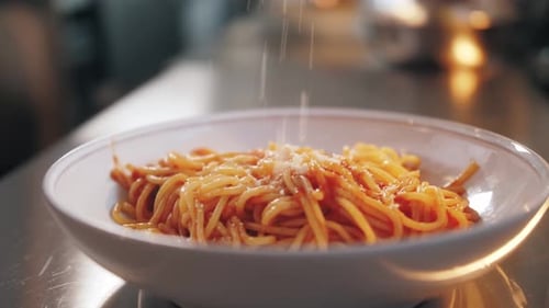 Adding Cheese to Spaghetti Close Up