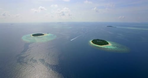 Aerial drone view of scenic tropical islands in the Maldives.