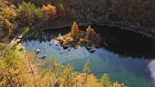 Aerial View of Mountain Lake with Pine Forest Aroundin the Middle Little Island with Pine and