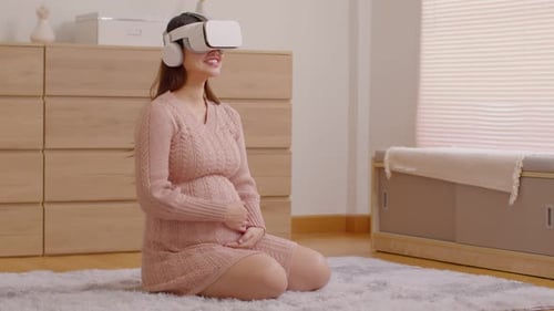 Pregnant Woman Using VR Headset in Bright Home