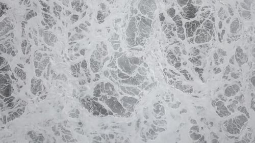 Scenic view of sea with foamy waves
