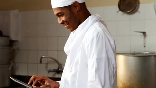 Chef Uses Tablet in a Commercial Kitchen