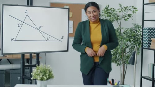 Geometry Teacher Giving Online Lecture Pointing at Electronic Board Speaking Looking at Camera