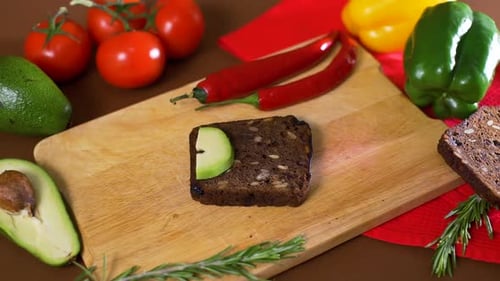 Preparing Healthy Avocado and Tomato Open-Faced Sandwich