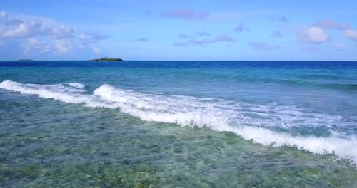 Wide angle aerial abstract shot of a sandy white paradise beach and aqua blue water background