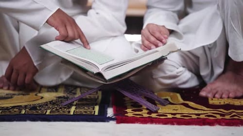 People Reading Religious Text Indoors Close Up