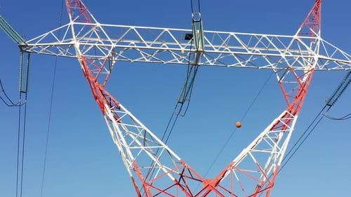 Transmission tower supporting an overhead high voltage power line - close up