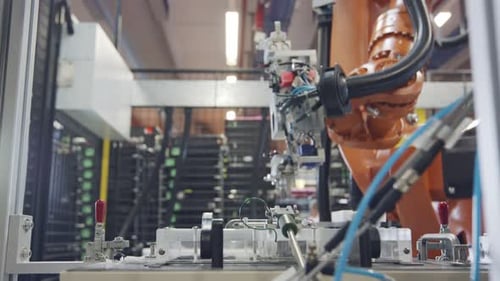 Robot working in an electronics manufacturing facility