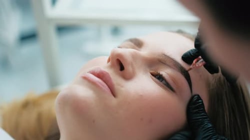 Cosmetologist Making Eyebrow Permanent Makeup