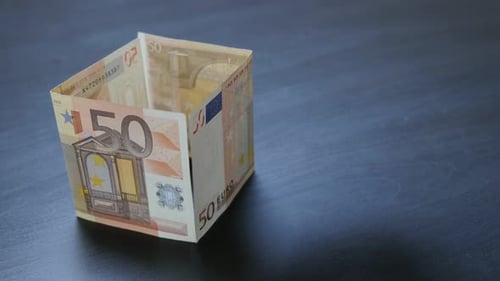 Business concept of house building with fifty Euro money bills 4K 2160p 30fps UltraHD video - Adding