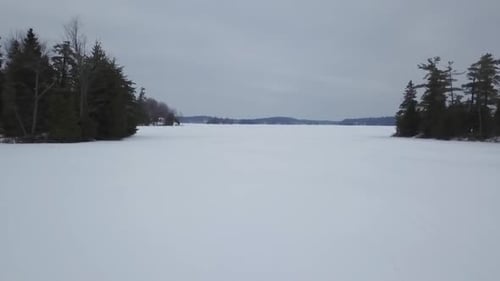 Aerial Drone View Flying Over Frozen Ice Lake In Winter 1