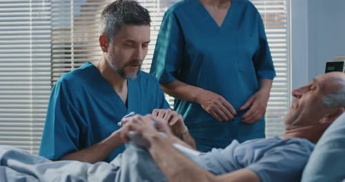 Doctor Using Stethoscope in Hospital