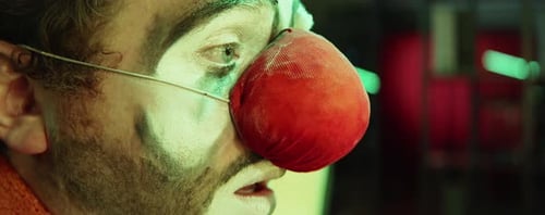 Close Up of Man in Clown Makeup with Red Nose