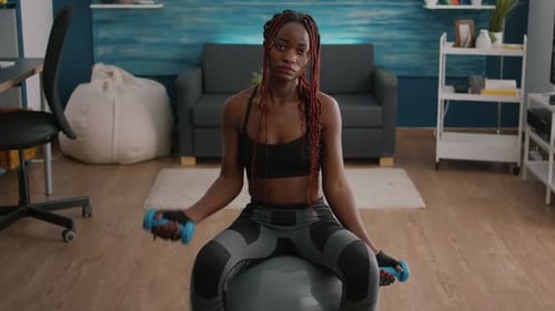 Woman Working Out with Dumbbells at Home