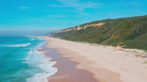 Flight Over the Sandy Beach and Waves