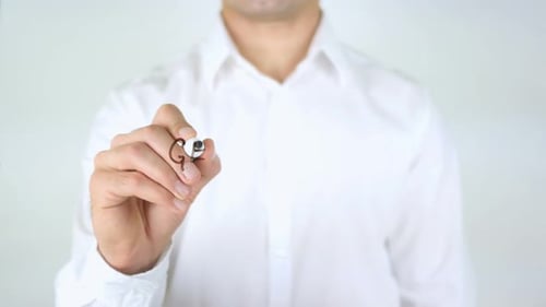 Man Writes 'Get More Done' on Clear Surface