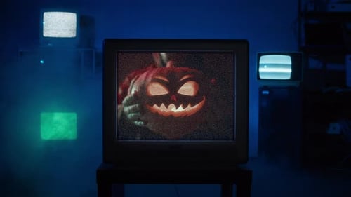 Creepy Jack-O-Lantern Displayed on a Vintage Television