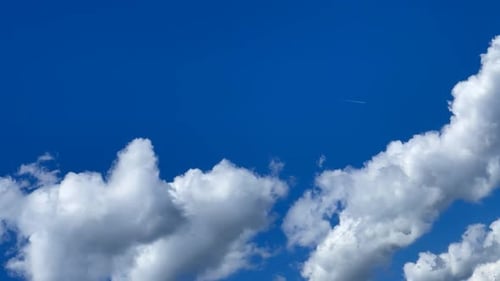 Fluffy White Clouds Against a Brilliant Blue Sky