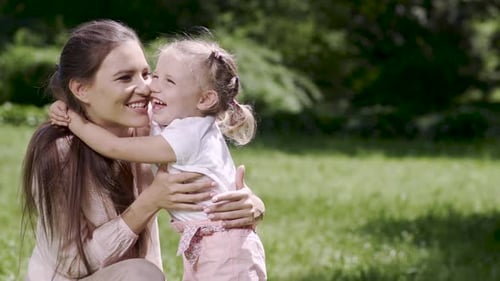 Mom And Child Enjoying Leisure Together At Park