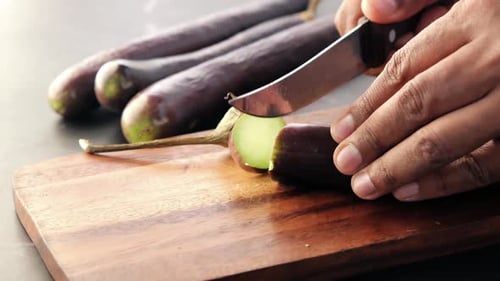 Top View of Cutting Eggplant on a Chopping Board