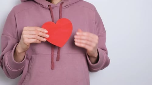 Mauve Hoodie Holds a Red Heart