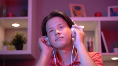Listening to music in the room.