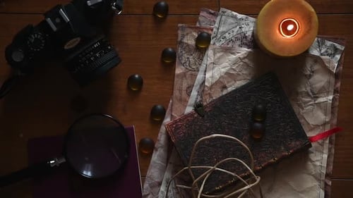 Vintage Camera and Maps on Wooden Table