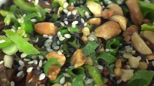 Delicious Asian Noodle Salad Topped with Sesame and Peanuts