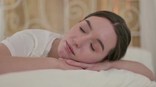 Close Up of Young Woman Sleeping in Bed Peacefully