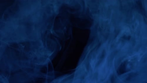 Abstract Blue Vapor Motion on Black Background