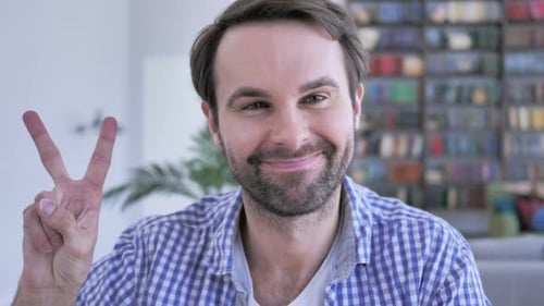 Victory Sign By Casual Beard Man in Office