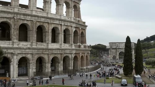 Many Tourists Walking Near Coliseum Amphitheater in Rome, Italy. Sightseeing