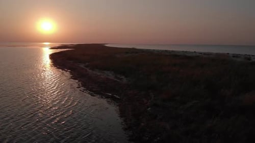 Beautiful Sunset at the Waving Sea