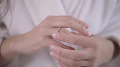 Woman's Hand with Diamond Engagement Ring