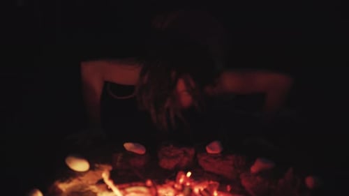 Scary Witch Does Voodoo Black Magic Ritual Near the Fire at Night