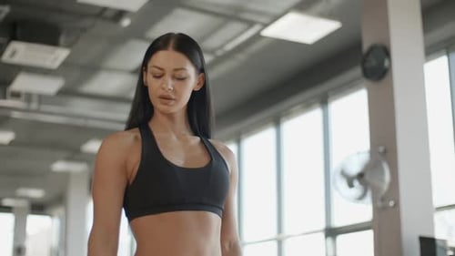 Attractive Woman Training with Barbell in the Gym Portrait Sport Hand