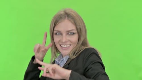 Excited Businesswoman Dancing and Celebrating Against Chroma Key