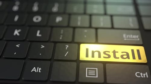 Black Computer Keyboard and Gold Install Key