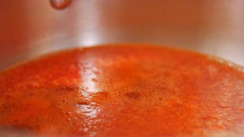 Red Sauce Simmering in a Metal Pot