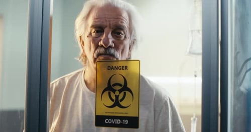 Elderly Patient Walking in Coronavirus Ward