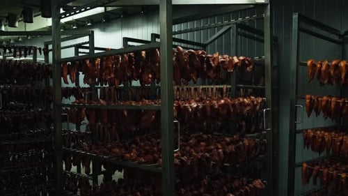 Racks of Cured Meat in Industrial Refrigerator